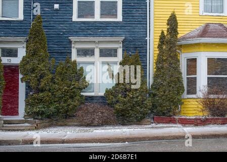 St. John's, Newfoundland/Canada-October 2020:  A street view of colorful vintage wooden buildings during a snow flurry.