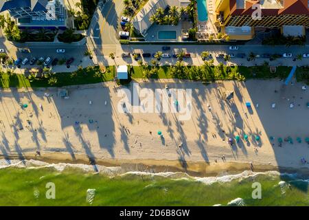 Aerial beahc photo at dusk long palm tree shadows Stock Photo