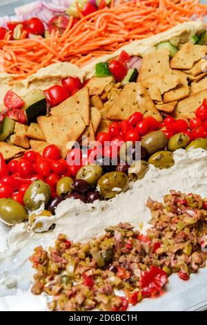 Greek olive hummus platter with sweety drop miniature peppers and pita chips Stock Photo