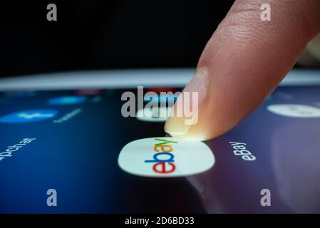 Wide angle close-up view of clicking ebay app icon Stock Photo
