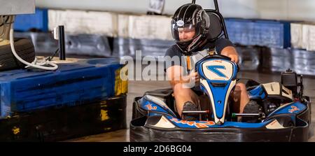 Mackay, Queensland, Australia - January 2020: A man rides a go-kart in a fun recreational drive around a circuit in public Stock Photo