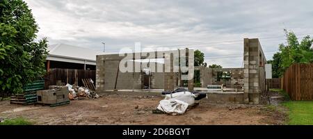 Mackay, Queensland, Australia - March 2020: Building the foundations and walls of a house under construction in a residential suburb. Shown here after Stock Photo