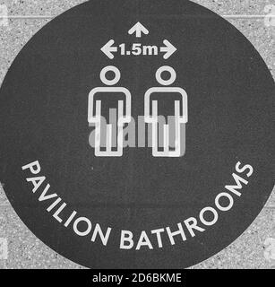 Townsville, Queensland, Australia - June 2020: Signage stating minimum distance in bathrooms during Covid-19 social distancing restrictions