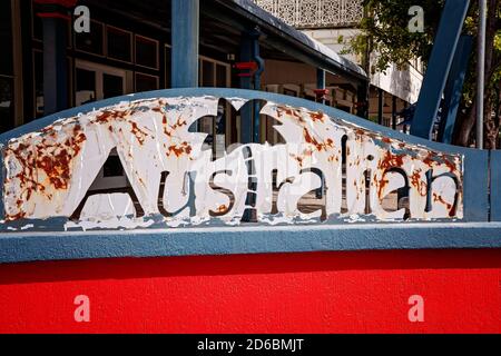 Townsville, Queensland, Australia - June 2020: Rusted iron sign with the words Australian in city street Stock Photo
