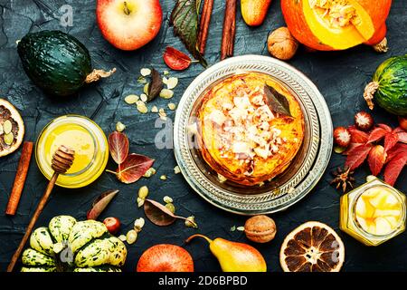 Stack of homemade pumpkin pancakes.Pumpkin pancakes with honey Stock Photo