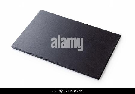 Angled shot of a black stone plate placed on a white background Stock Photo
