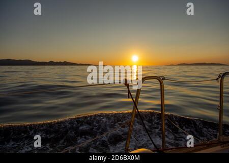 Sunset seen from a travelling sailboat,Cyclades,Greece Stock Photo