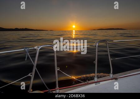 Sunset seen from a travelling sailboat,Cyclades,Greece Stock Photo