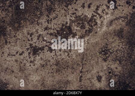Red Brown Toned Concrete real natural wall deep cracks scratches old destroyed surface texture. Dark shadows. Background wallpaper web design Stock Photo