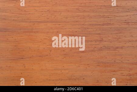New and clean wall made of spruce tree's wood boards, viewed from the front. High resolution full frame textured background. Stock Photo