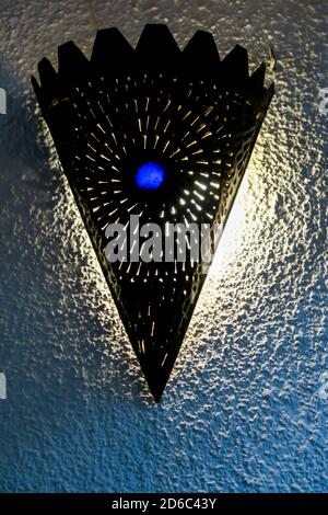 old lamp on the wall, photo as background Stock Photo