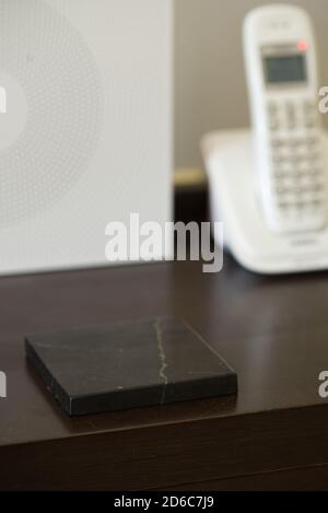 A Shungite stone to protect against Electro magnetic field ( EMF ) Stock Photo