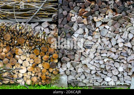 Log pile, wood pile in the village of Rabat les Tres Seigneurs, Ariege, French Pyrenees, France, Pyrenees mountains in autumn. Stock Photo