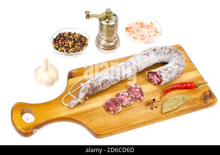 Dry-cured sausage in white mold casing. Studio Photo Stock Photo