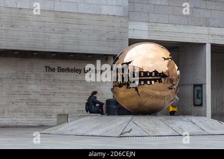 Dublin, Ireland -10 November 2015: Golden ball outside the Berkeley Library, Trinity College, New Square. Stock Photo