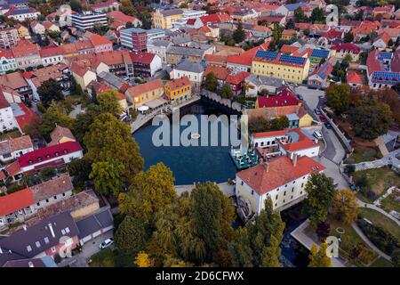 The Mill Pond (Malom-tó) in Tapolca. The Lake is surrounded by antique buildings and high stone walls, is the most popular place of the town. Amazing Stock Photo