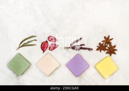 Colored soap bars on a white marble background in a top view Stock Photo