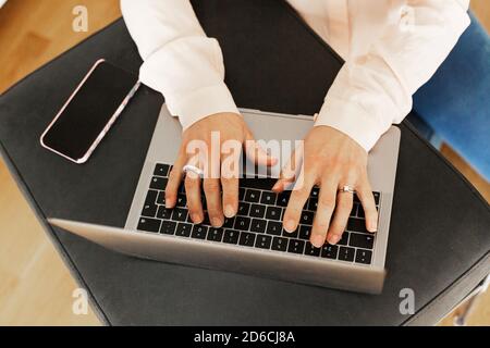 Hands typing on laptop keyboard Stock Photo