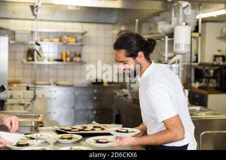 Chef working in kitchen Stock Photo