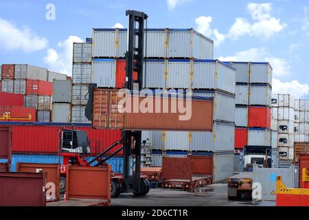 Mobile container handlers were operated at the cargo terminal in the port. Stock Photo