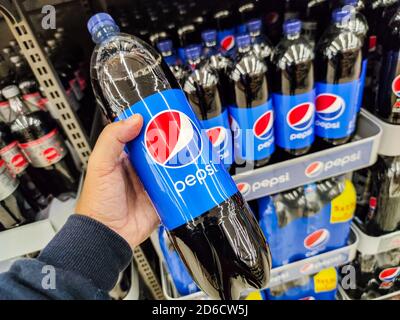 Puilboreau, France - October 14, 2020:Closeup of Man hand buying Pepsi Max soft drink on French supermarket Stock Photo