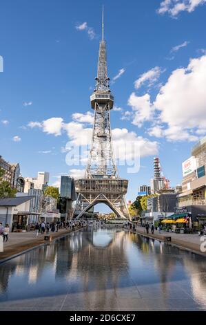 Nagoya TV tower reflecting in a water pool. New Hisayaodori Park refurbished in 2020. Stock Photo