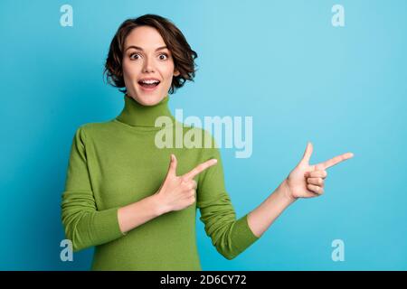 Portrait of astonished girl promoter point index finger copyspace indicate incredible advertisement promo impressed wear good look sweater isolated Stock Photo