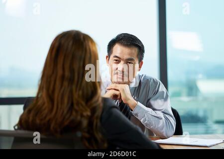 asian hr manager interviewing a female job candidate in office Stock Photo