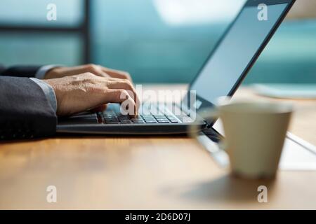 close-up shot of hands of an asian businessman working on laptop computer Stock Photo