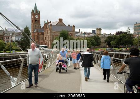 18.07.2019, Derry, Northern Ireland, United Kingdom - The Peace Bridge (funded by EU, opened in 2011), The Modernist Bridge over the River Foyle is a Stock Photo