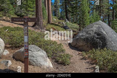 ANGORA LAKES, CALIFORNIA, UNITED STATES - Oct 14, 2020: A trail sign marks Angora Ridge Trail, a hiking trail near Angora Lakes in the Lake Tahoe Basi Stock Photo