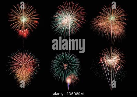 Six colorful fireworks on black background, New Year celebration concept. Stock Photo