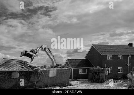 Heavy machinery demolishes private house to make way for development of new Lidl supermarket along Minster Way in Beverley, Yorkshire, UK. Stock Photo