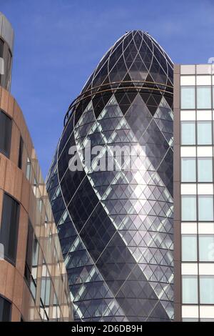 LONDON, UK - JULY 6, 2016: Street view of 30 St Mary Axe building in London. It was completed in 2003 and is among top 10 tallest London buildings (at Stock Photo