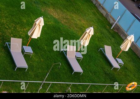 End of summer symbol. Hammocks by an empty pool at the end of the summer Stock Photo