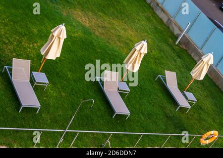 End of summer symbol. Hammocks by an empty pool at the end of the summer Stock Photo