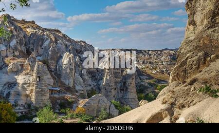 Fabulous natural volcanic tuff formation with cave rock houses in Open-air Museum Goreme,Cappadocia valley,Turkey Stock Photo