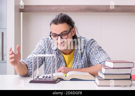 Male student preparing for exam at home Stock Photo
