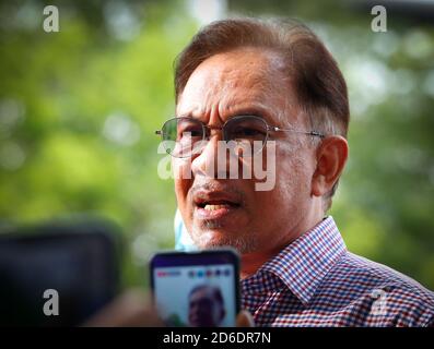 Malaysian opposition leader, Anwar Ibrahim speaks to media at the Bukit Aman police headquarters after questioning by police over his claim that over 120 Members of Parliament support his bid to form the next federal government. Total 113 police reports have been lodged against the opposition leader. Stock Photo