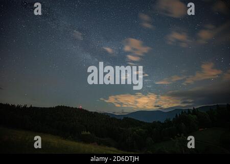 Milky Way over the northern Black Forest in summer at night. Stock Photo