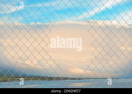 Hole in a chain link fence Stock Photo