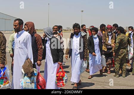 Aden, Yemen. 16th Oct, 2020. Yemeni prisoners, who were held by Houthi, arrive at an airport in the southern city of Aden, after being released on the second day of a prisoner swap between the Yemeni government and the Houthi movement. More than 1,000 people detained in relation to the conflict in Yemen are to be transported back to their region of origin or to their home countries by The International Committee of the Red Cross (ICRC) in the largest operation of its kind during the five-and-a-half-year war. Credit: Wail Shaif/dpa/Alamy Live News