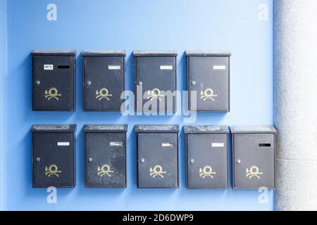 Post boxes on a house wall in Siburi, Romania Stock Photo