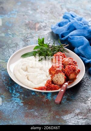 Meatballs in tomato sauce with mashed potato, selective focus Stock Photo