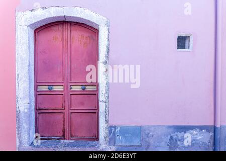 Wrought iron door of an ancient Tuscan house Stock Photo