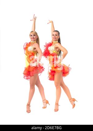 Two female salsa dancers in colorful dresses Stock Photo