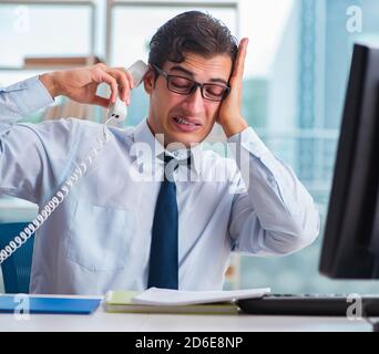 The businessman suffering from excessive armpit sweating Stock Photo