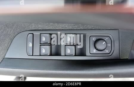 Side mirror switch control, car interior detail Stock Photo