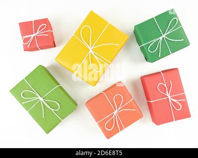 Red, yellow, green and orange gift boxes on a white background. Stock Photo