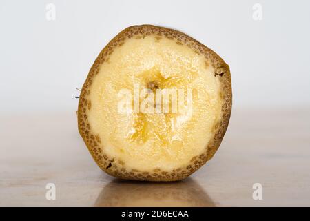 Halved banana on table Stock Photo